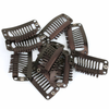 10 Warm Black 1.25 inch rubber backed weave clips on white background