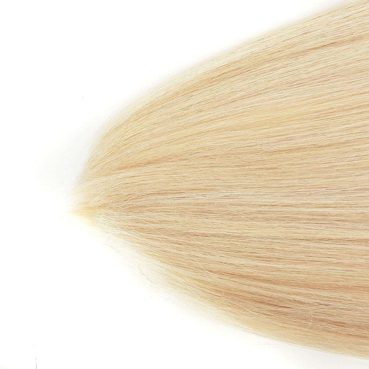 Close up of double drawn platinum blond ends on 22 inch 7 piece clip set