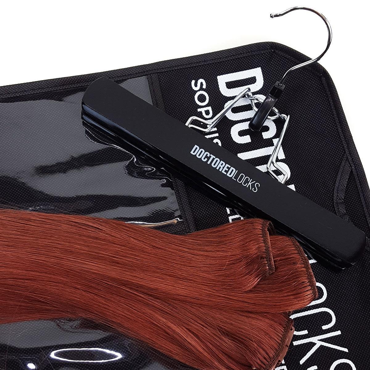 Dark natural red human hair clip-in extensions with Doctored Locks storage hanger and storage bag for extensions