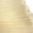Close up of platinum blonde cuticle intact remy quality hair on 7 piece clip in hair extensions