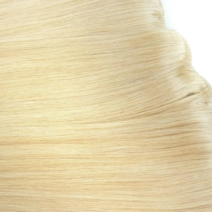 Close up of platinum blonde cuticle intact remy quality hair on 7 piece clip in hair extensions