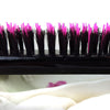 Close up of pink and black bristles on Little Wonder teasing hairbrush