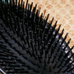 Close up of stiff nylon bristles on hair brush for extensions