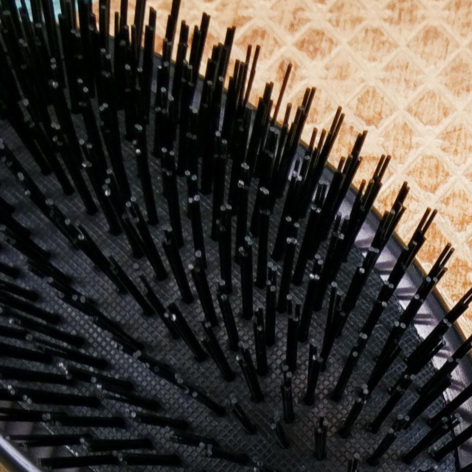 Close up of stiff nylon bristles on hair brush for extensions