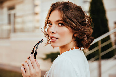 woman with fine hair curled and smiling