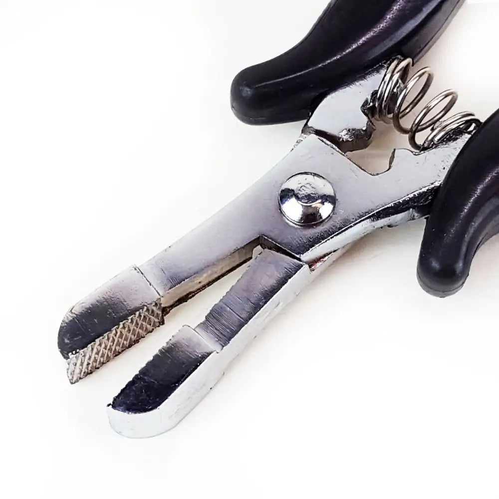 Metal crushing pliers portion of fusion bond crusher