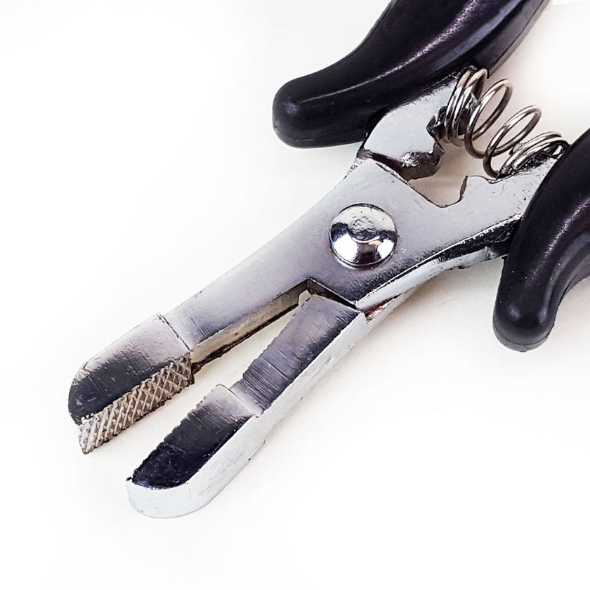 Metal crushing pliers portion of fusion bond crusher