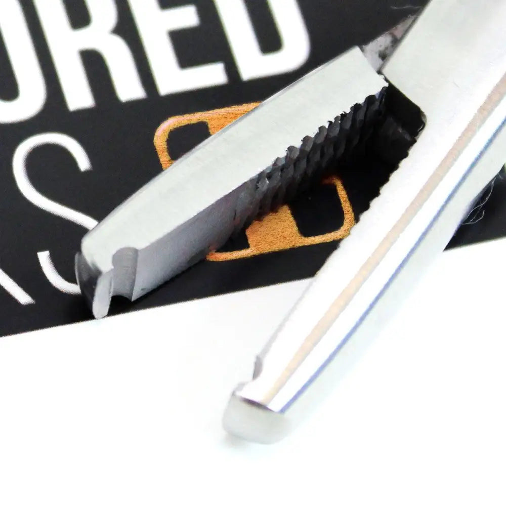 Close up of stainless steel nano microbead opener tool mouth
