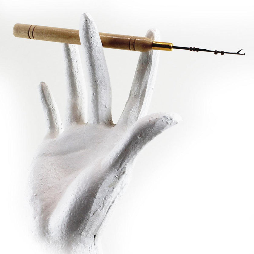 Wood handle nano microneedle displayed in mannequin hand