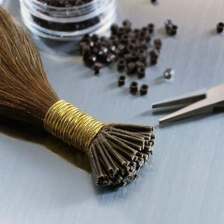 click here for I-tip hair - image is 100% human hair remy I tip prebond hair extensions with beads and tools in the background