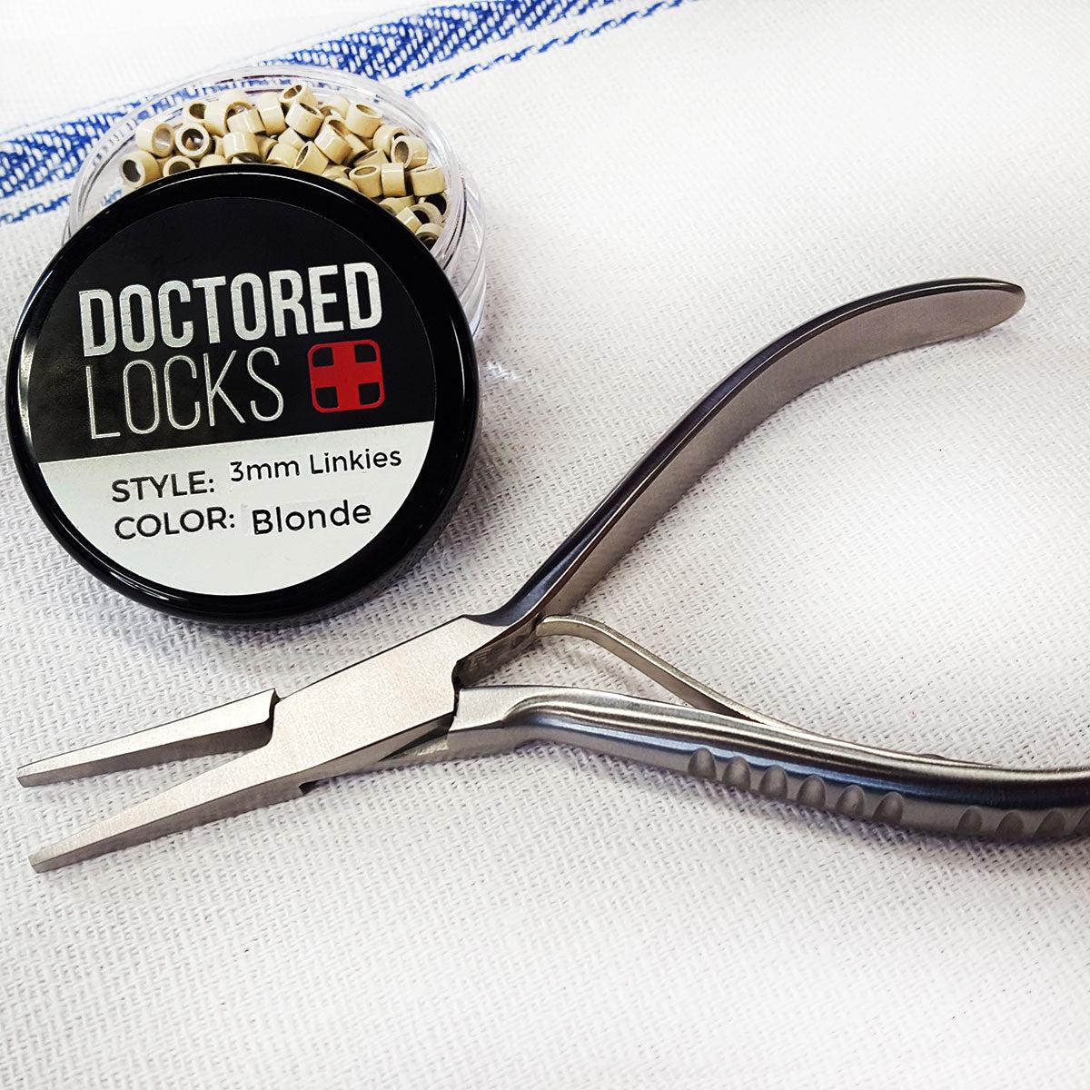 Stainless steel flat glide closer tool next to Doctored Locks blonde linkies microrings