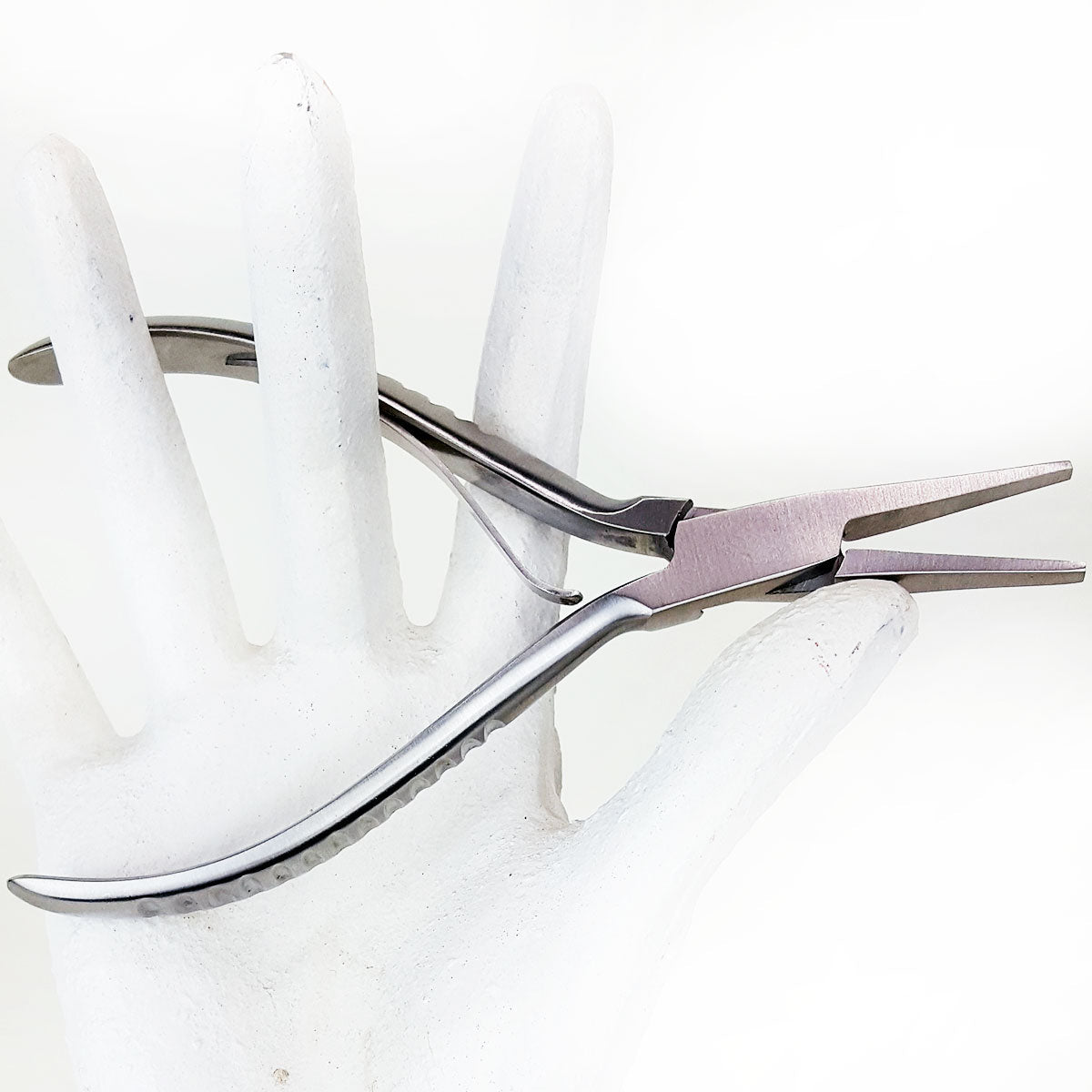 Stainless steel flat glide clamp closer for linkies and microrings in mannequin hand