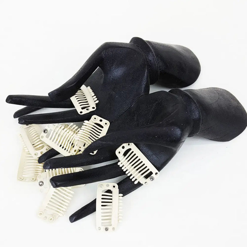 10 blonde 1.25 inch weave clips for hair extensions in mannequin hands